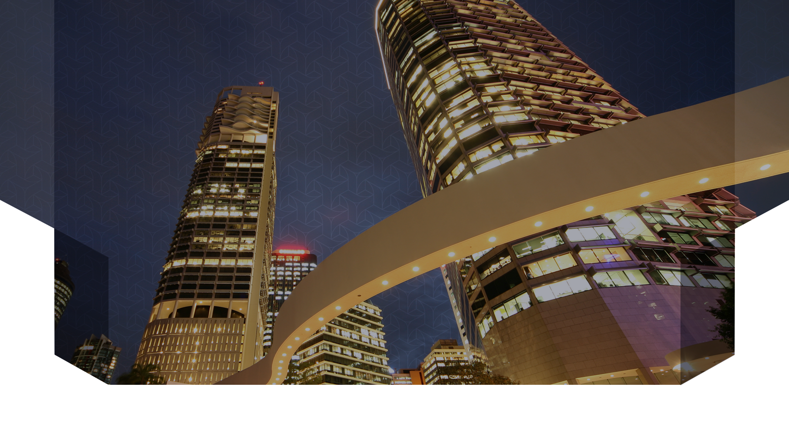 Illuminated city buildings representing connected asset operations